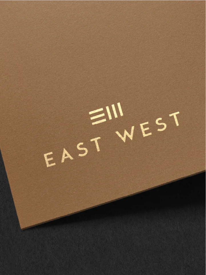 East West letterhead logo
